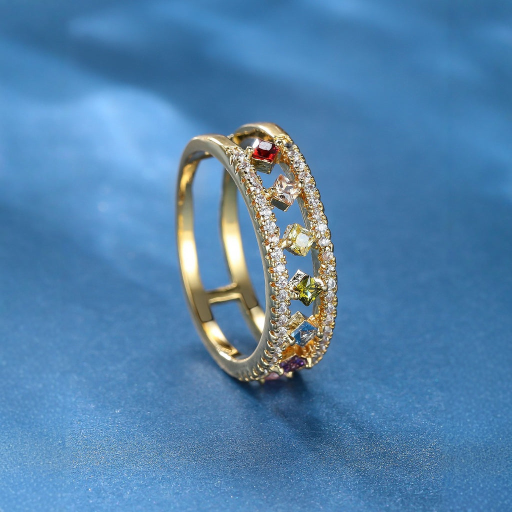 Damen Ring mit funkelnden, farbigen Zirkonia und eleganter Goldfassung Shop Nory