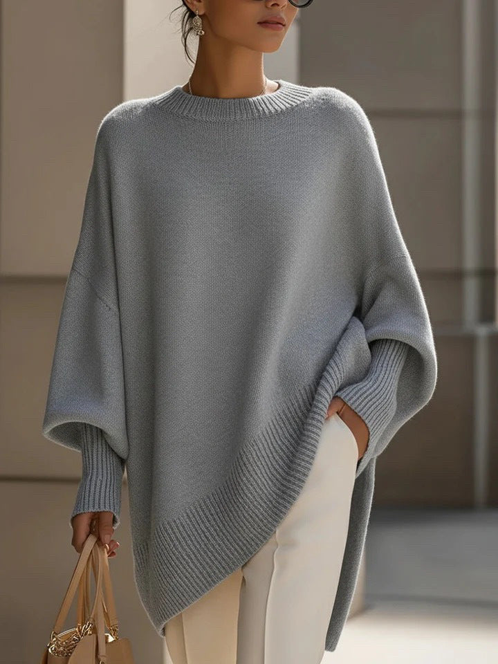 Damen nan Oversize Strickponcho mit asymmetrischem Saum und gerippten Ärmeln Shop Nory