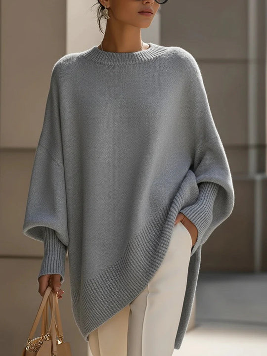 Damen nan Oversize Strickponcho mit asymmetrischem Saum und gerippten Ärmeln Shop Nory