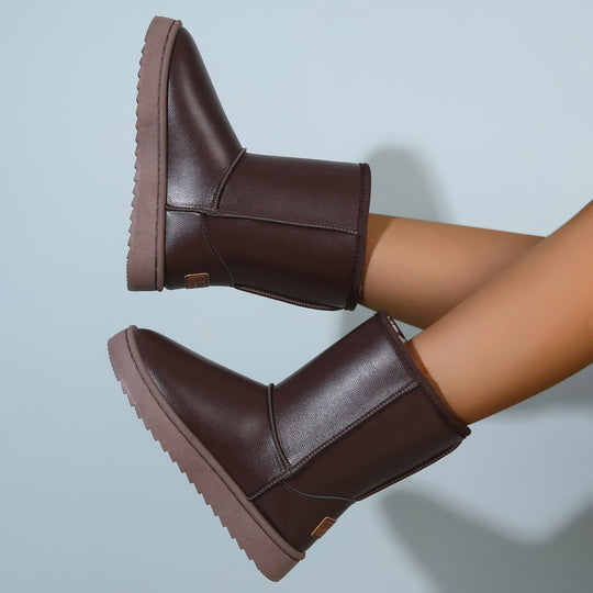 Damen Winterstiefel mit Teddyfutter, Lederoptik und flacher Plateau‑Sohle Shop Nory