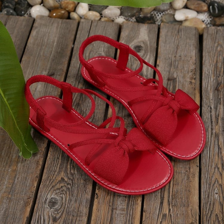 Damen Zarte Römersandalen mit Schleifen-Detail und verstellbaren Schnürriemen Shop Nory