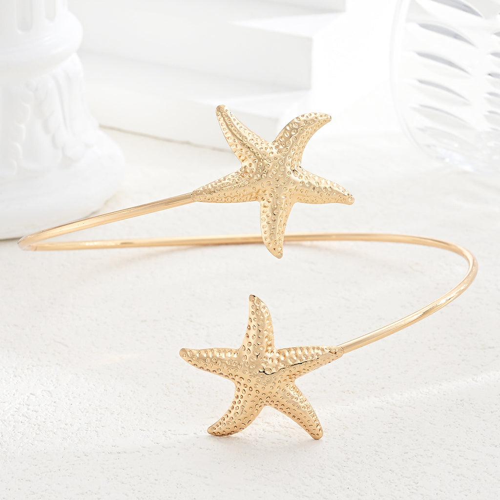 Damen goldfarbener Armreif mit maritimen Sternenmotiv Shop Nory