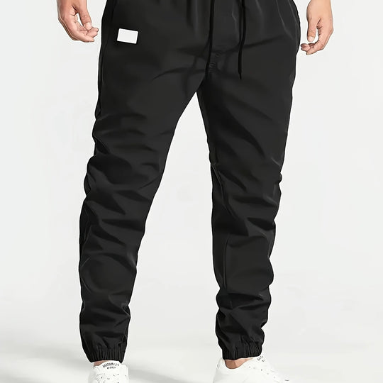 Herren Slim‑Tapered Tech‑Joggerhose mit Tunnelzugbund, elastischen Knöchelbündchen und funktionalen Seitentaschen Shop Nory