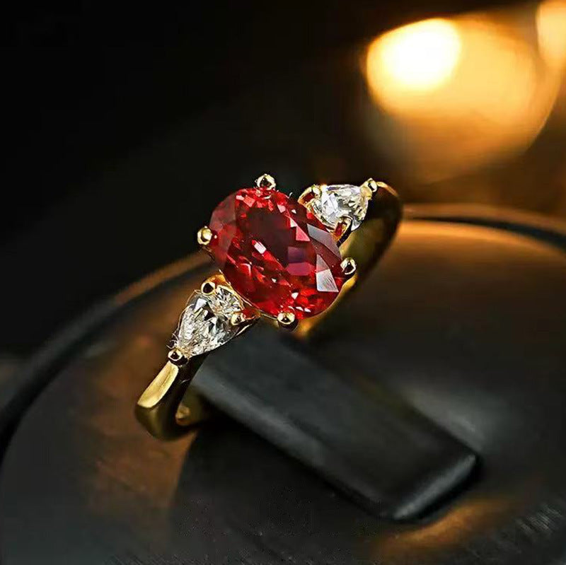 Damen eleganter Ring mit rot glühendem Edelstein und funkelnden Zirkonia Shop Nory