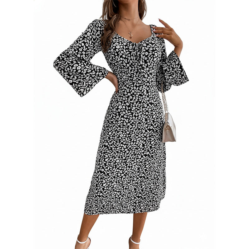 Damen Blumen-Midikleid mit taillierter Wickeloptik und ausgestellten Trompetenärmeln Shop Nory