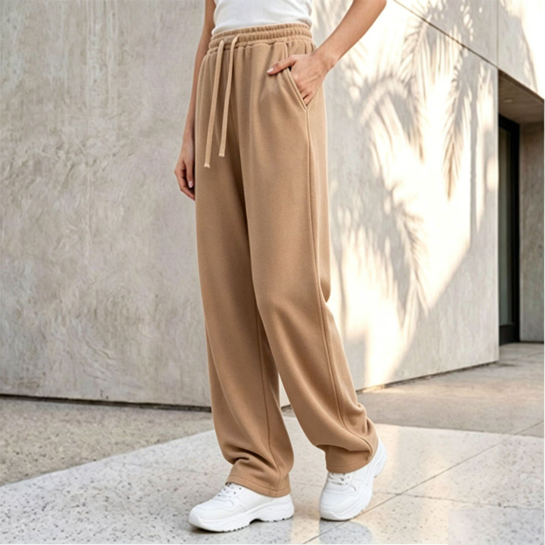 Damen nan weite Loungepalazzo-Hose mit hohem Komfortbund, Kordelzug, seitlichen Eingrifftaschen und dekorativer Seitennaht Shop Nory