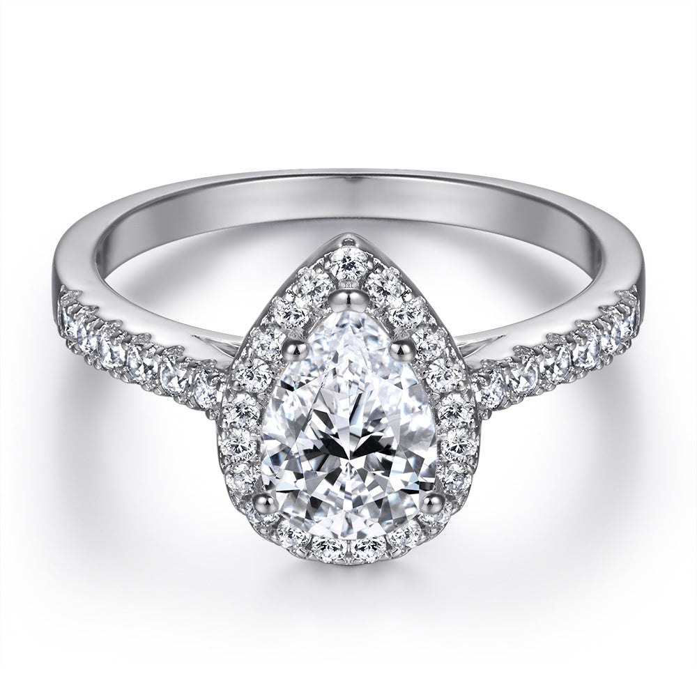 Damen eleganter Ring mit tropfenförmigem Hauptstein und funkelndem Zirkonia-Besatz Shop Nory