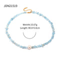 Damen Halskette mit pastelblauen Edelsteinen und einer eleganten Perle Shop Nory