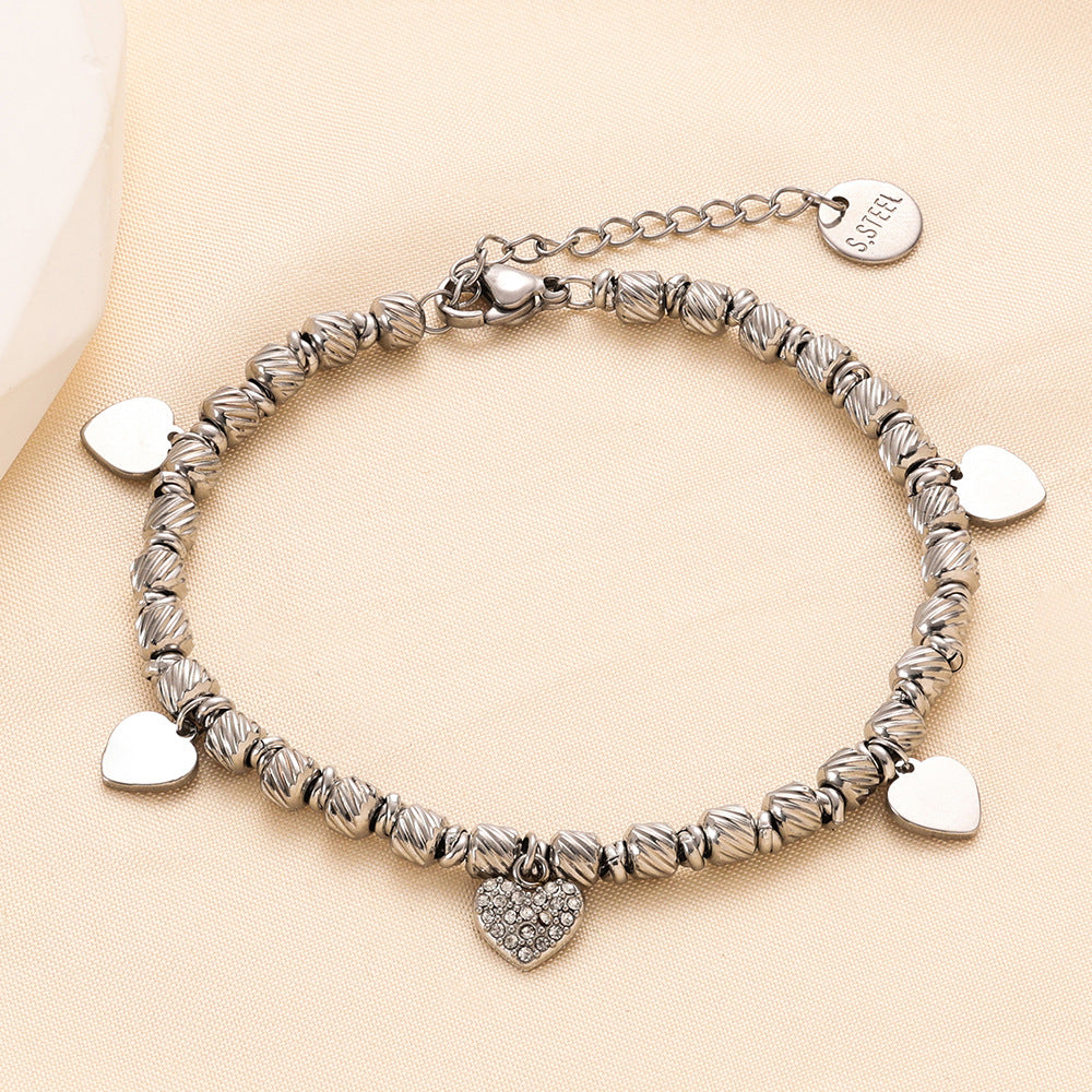 Damen Armband mit herzförmigen Anhängern und funkelndem Zirkonia Shop Nory