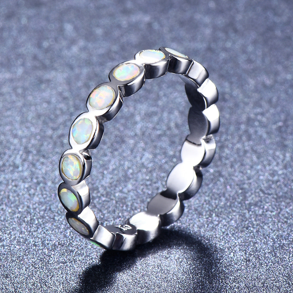 Damen Ring mit schillernden Opalsteinen und eleganter Edelstahlfassung Shop Nory