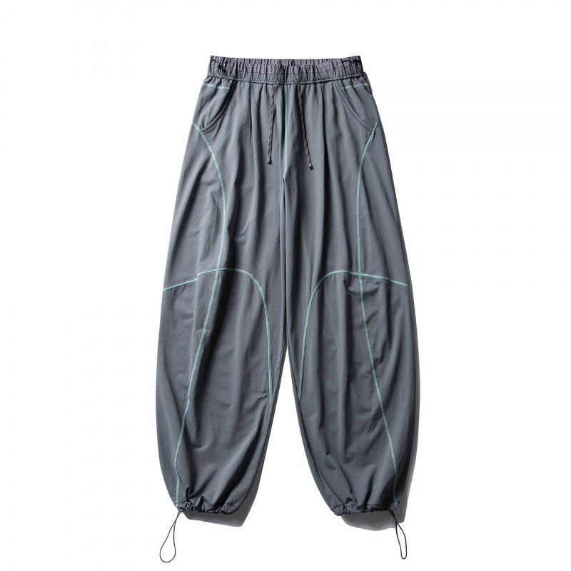 Unisex Locker geschnittene Tech-Jogginghose mit elastischem Bund, markanten Flatlock-Nähten und Kordelzug Shop Nory