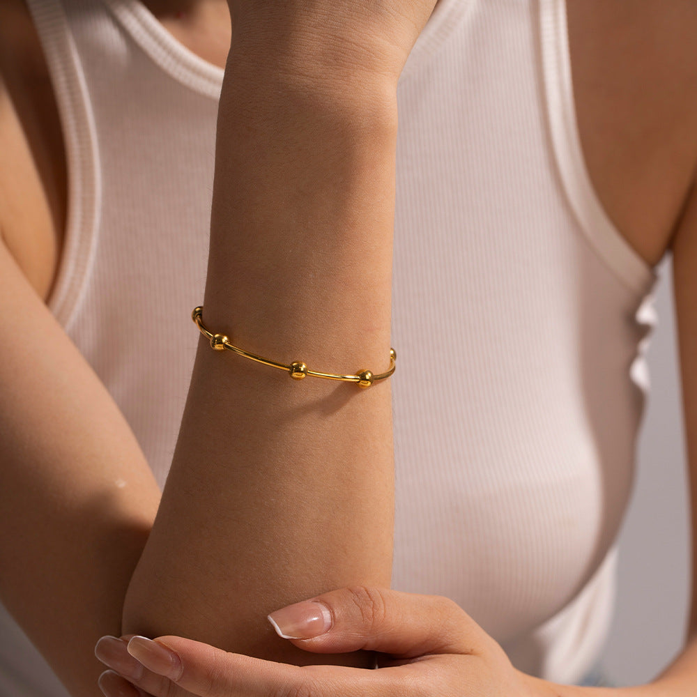 Damen Armreif mit elegantem Kugeldesign aus hypoallergenem Edelstahl Shop Nory