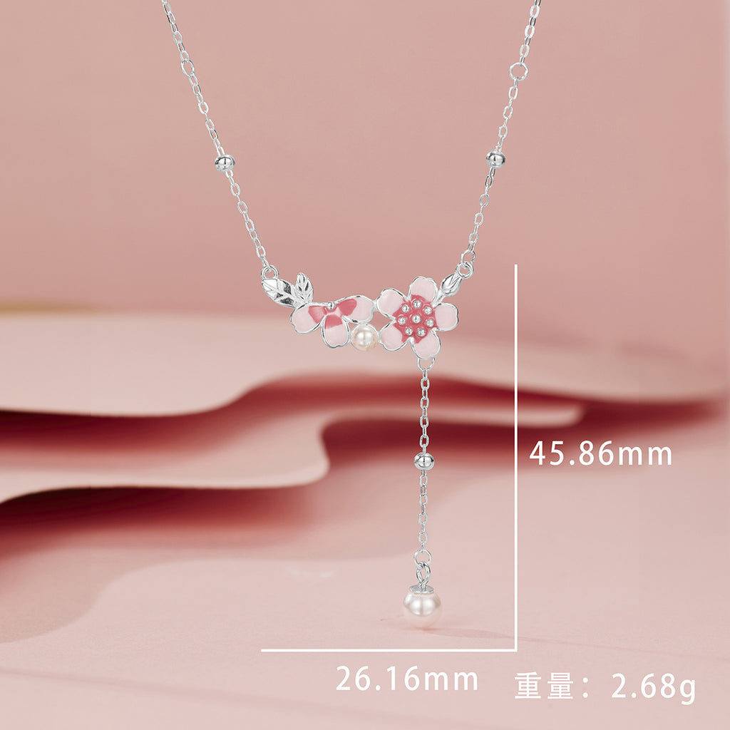 Damen filigrane Halskette mit floralen Anhängern und eleganter Perlenverzierung Shop Nory