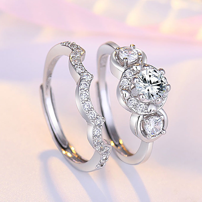 Damen Verlobungsring mit kunstvollem Zirkonia-Besatz und eleganter Wellenstruktur Shop Nory
