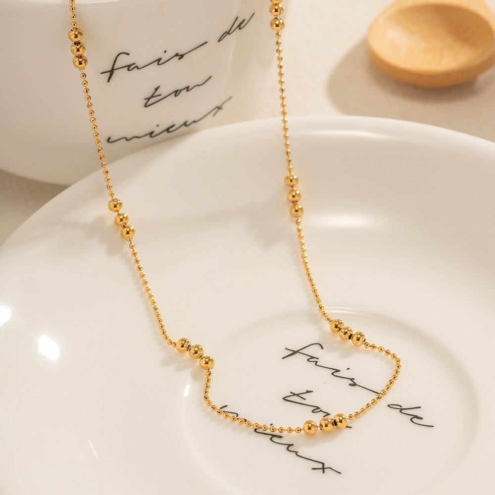 Damen Halskette mit schimmernden goldenen Kugeldetails Shop Nory