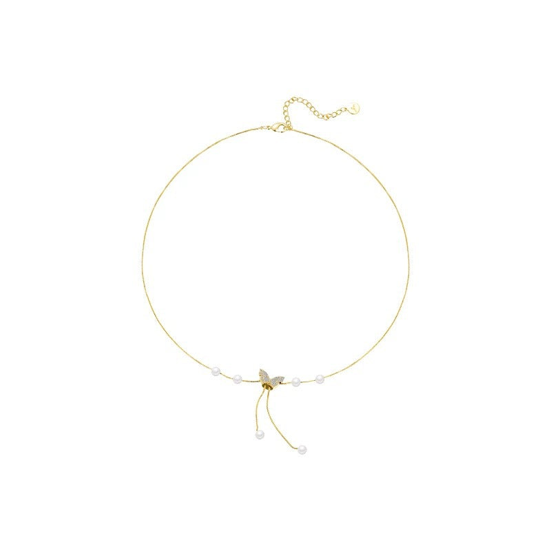 Damen Handkette mit funkelndem Schmetterlingsdesign und zarten Perlendetails Shop Nory