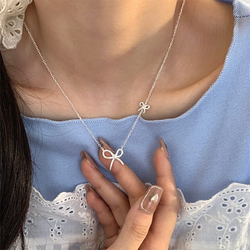 Damen Silberne Halskette mit stilvollem Schleifen-Design Shop Nory