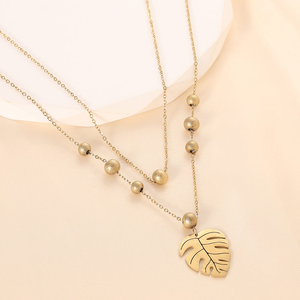 Damen Halskette mit herzförmigem Anhänger und eleganten Perlen Shop Nory