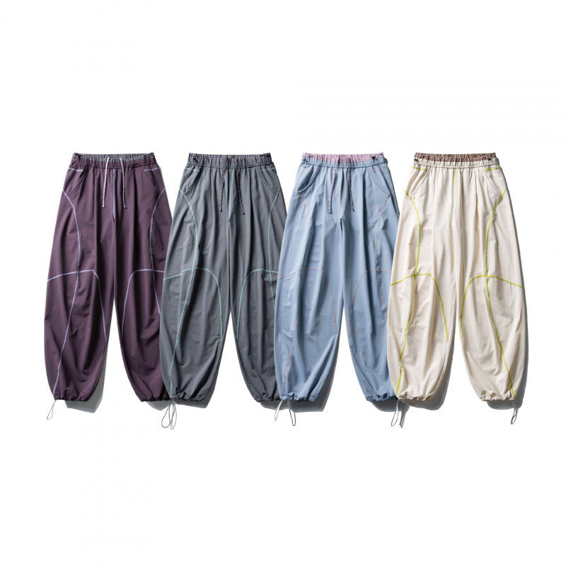 Unisex Locker geschnittene Tech-Jogginghose mit elastischem Bund, markanten Flatlock-Nähten und Kordelzug Shop Nory