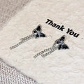 Damen Ohrstecker mit kunstvollem Schmetterlingsdesign und filigranen Kettendetails Shop Nory