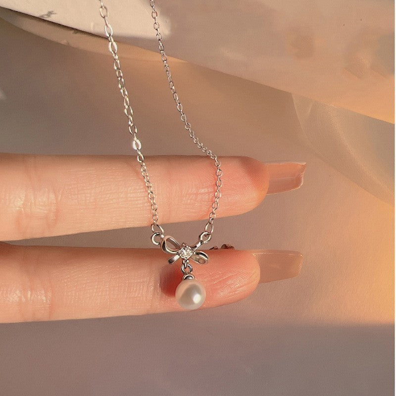 Damen Halskette mit eleganter Schleifen- und Perlenverzierung Shop Nory