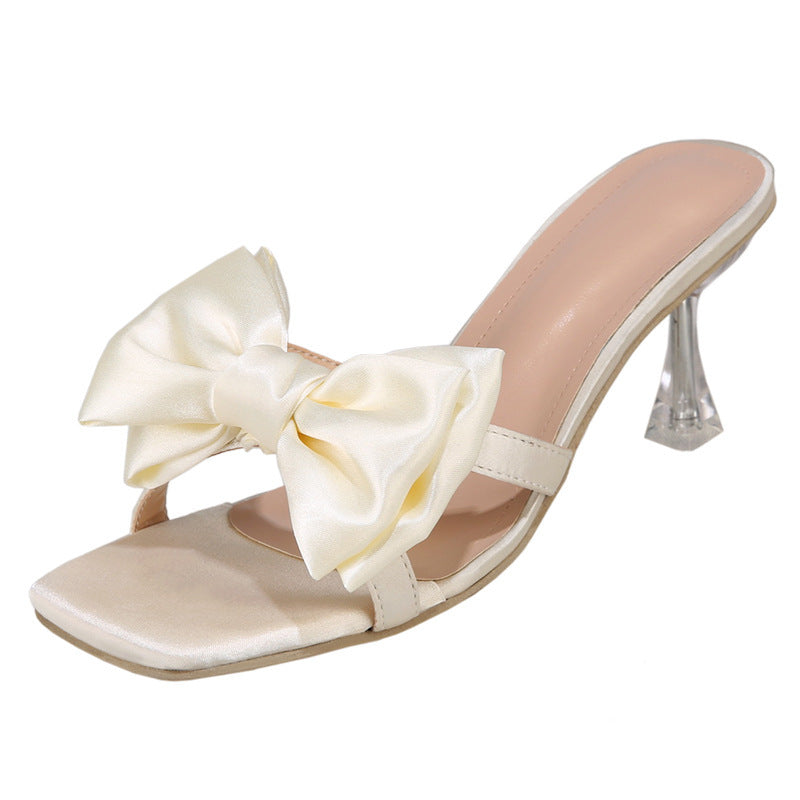 Damen High Heel Pantoletten mit eleganter Schleifen-Applikation und glitzerndem Absatz