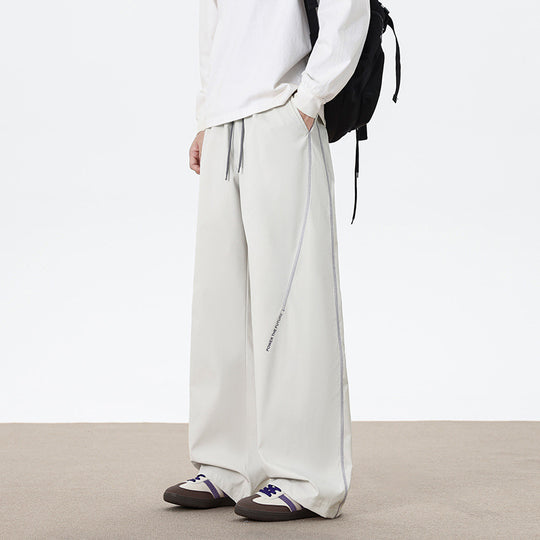 Herren Weitgeschnittene Sporthose mit reflektierenden Details