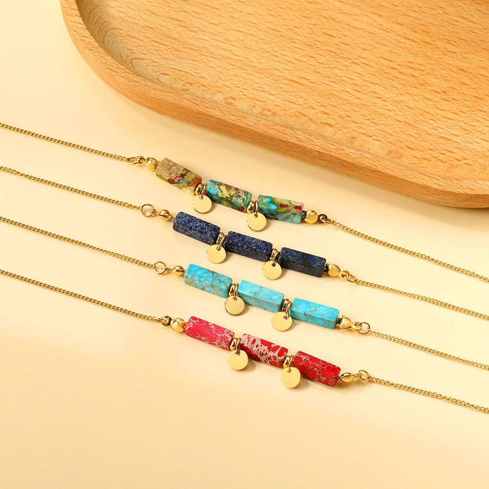 Damen Armband mit funkelnden Karibikstein-Elementen aus hochwertigem Edelstahl und goldplattierten Akzenten Shop Nory