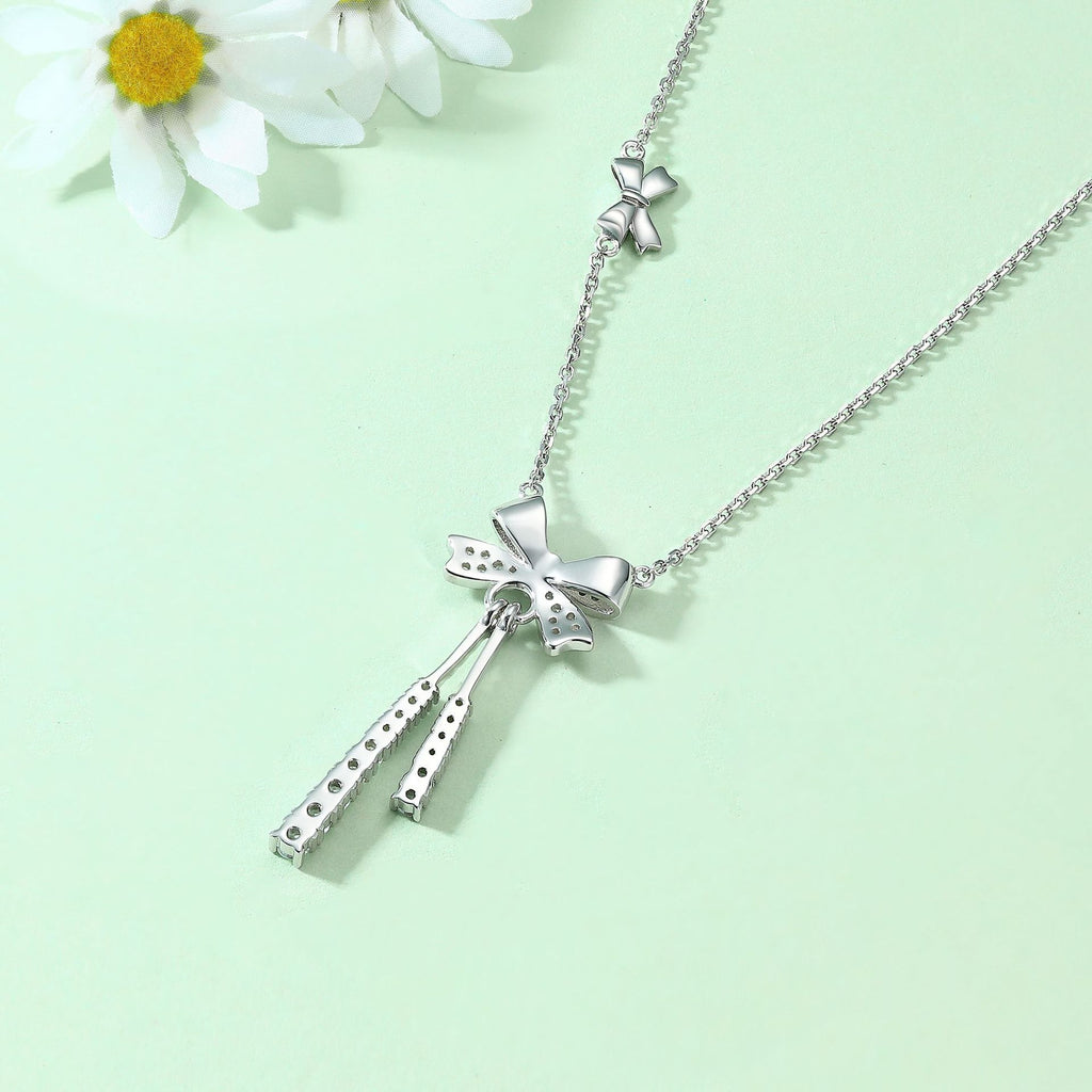 Damen Halskette mit kunstvollem Schleifenmotiv und funkelnden Zirkonia-Details Shop Nory