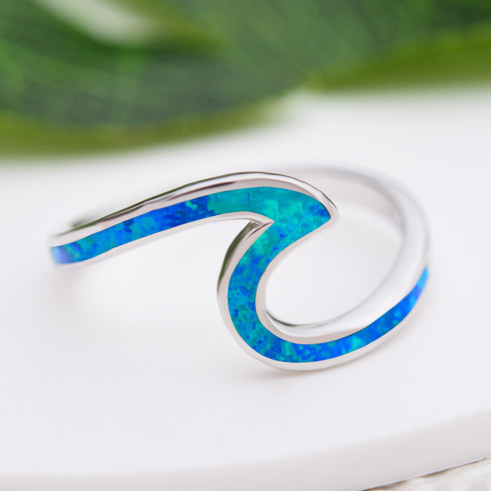 Damen Ring mit modernem, geschwungenem Design und opalisierten Akzenten Shop Nory