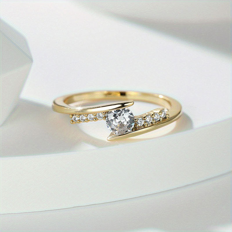 Damen eleganter Ring mit kunstvollem Wellenmuster und funkelnden Kristallen Shop Nory