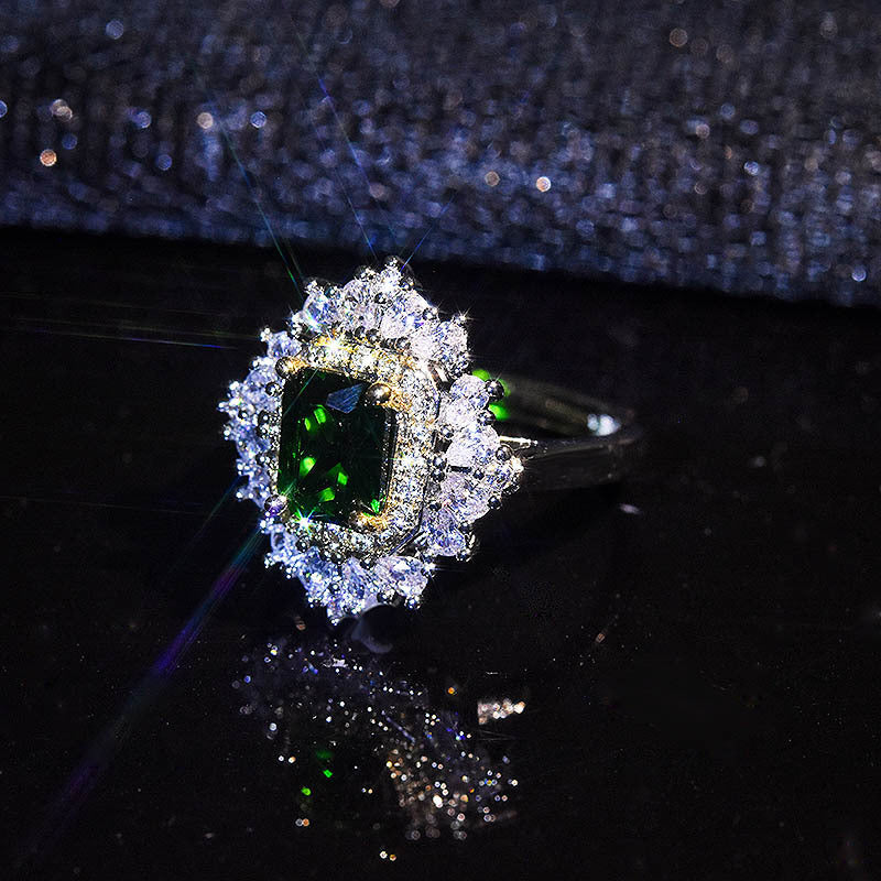 Damenring mit elegantem smaragdgrünem Edelstein und funkelnden Zirkonia-Steinen Shop Nory