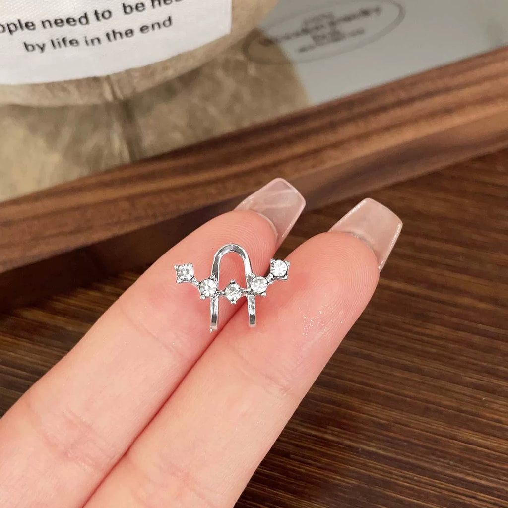 Damen Ohrringe im kreativen Clipdesign mit funkelnden Zirkonia Shop Nory