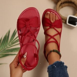 Damen Zarte Römersandalen mit Schleifen-Detail und verstellbaren Schnürriemen Shop Nory