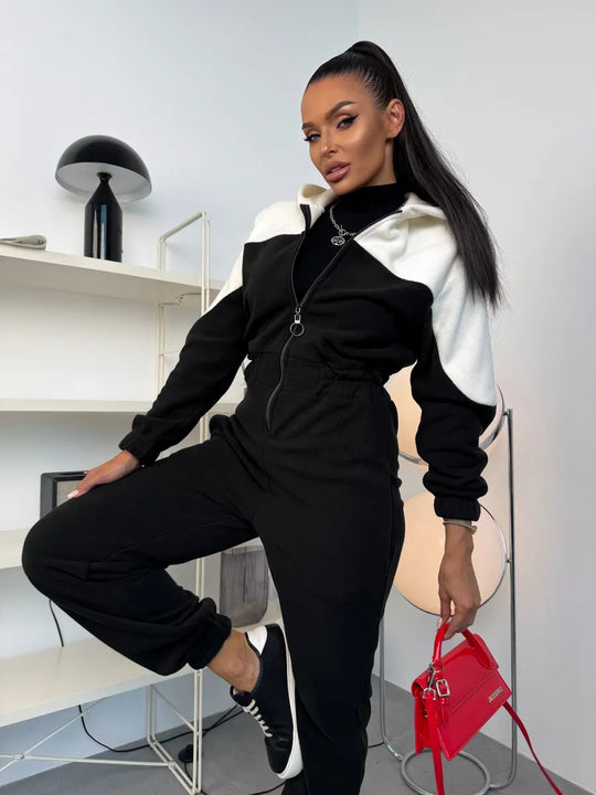 Damen gemütlicher Fleece-Overall mit Kapuze, durchgehendem Reißverschluss und elastischen Bündchen Shop Nory