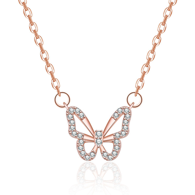 Damen Halskette mit filigranem Schmetterlingsanhänger und funkelnden Kristallen Shop Nory