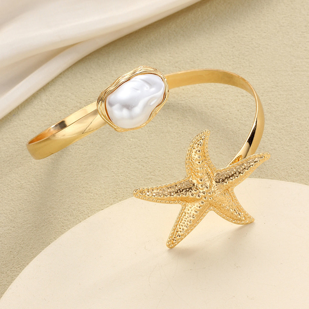 Damenarmband mit maritimen Sternen- und Perlenmotiven Shop Nory