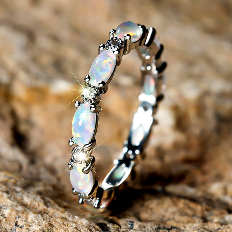 Damen Ring mit funkelnden Opalsteinen und filigranem Design Shop Nory