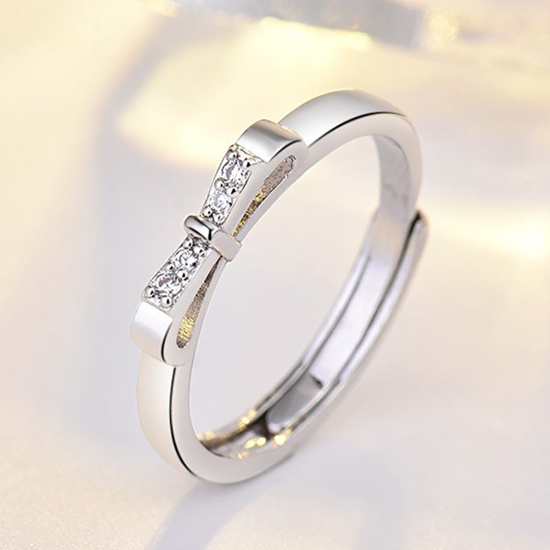 Damenring mit kunstvollem Schleifenmotiv und funkelnden Zirkonia-Details Shop Nory