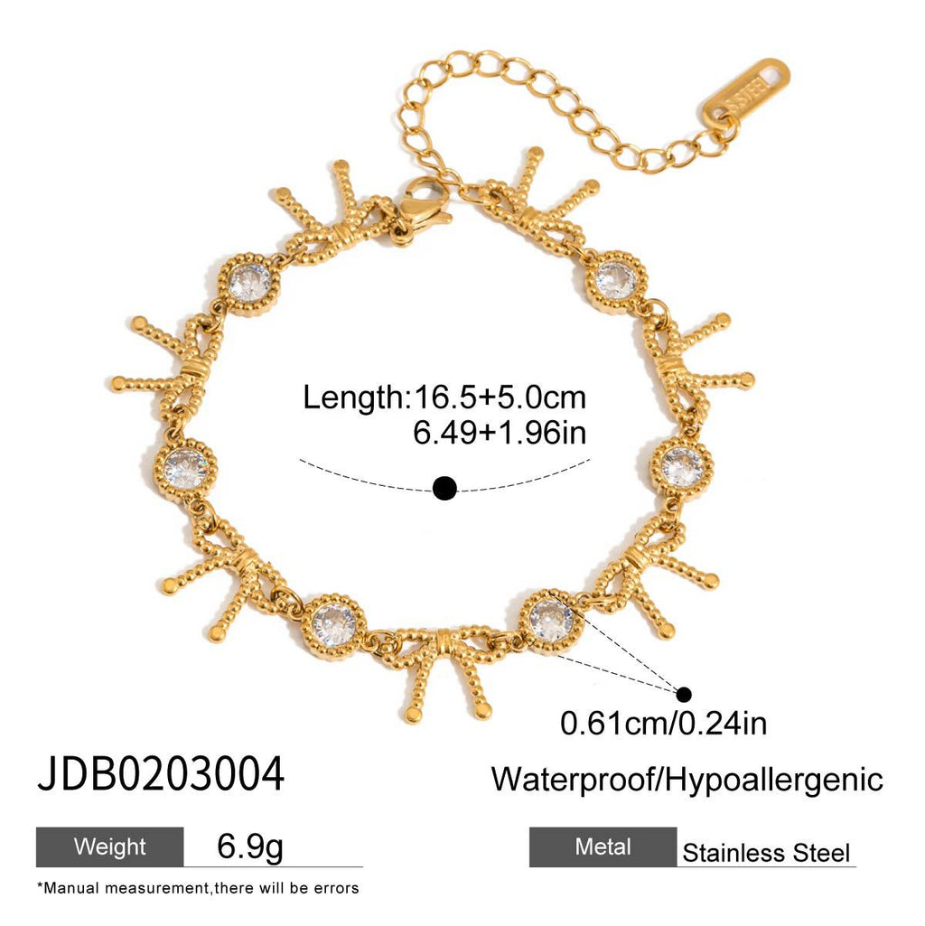 Damen Armband mit funkelnden Kristallen und elegantem Muschel-Design Shop Nory