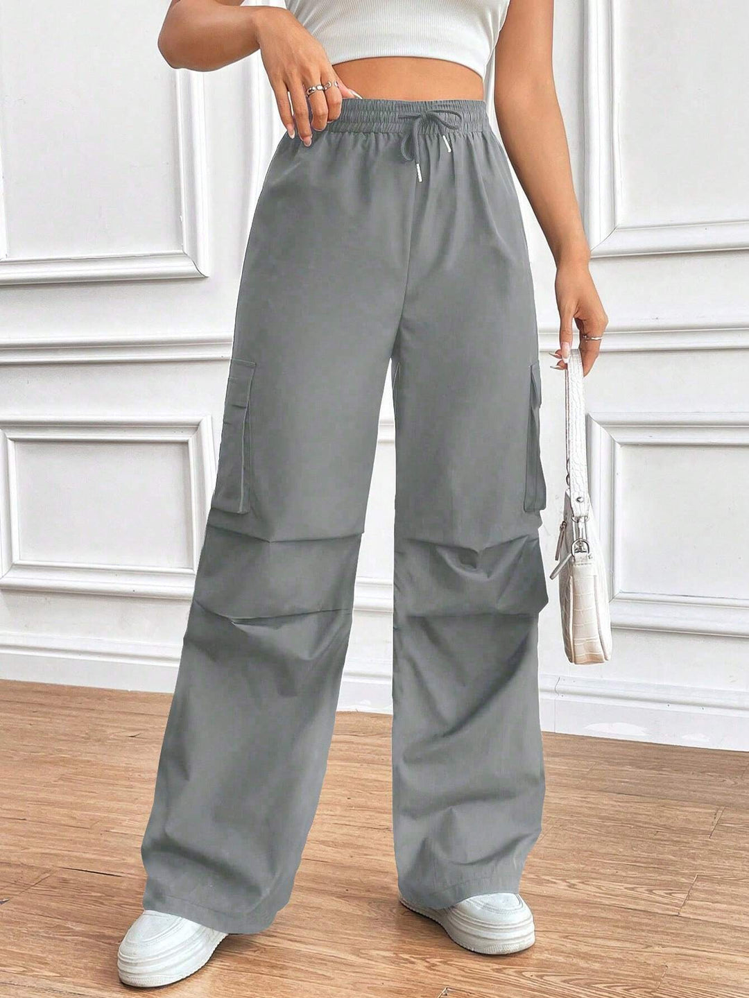 Damen Weite High‑Waist Cargo‑Hose mit Elastikbund und großen Klappentaschen Shop Nory