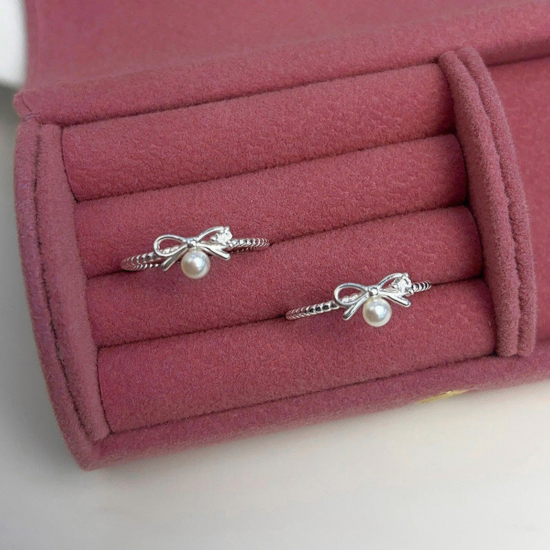 Damen Ring mit verspieltem Schleifendesign und Perlenakzent Shop Nory