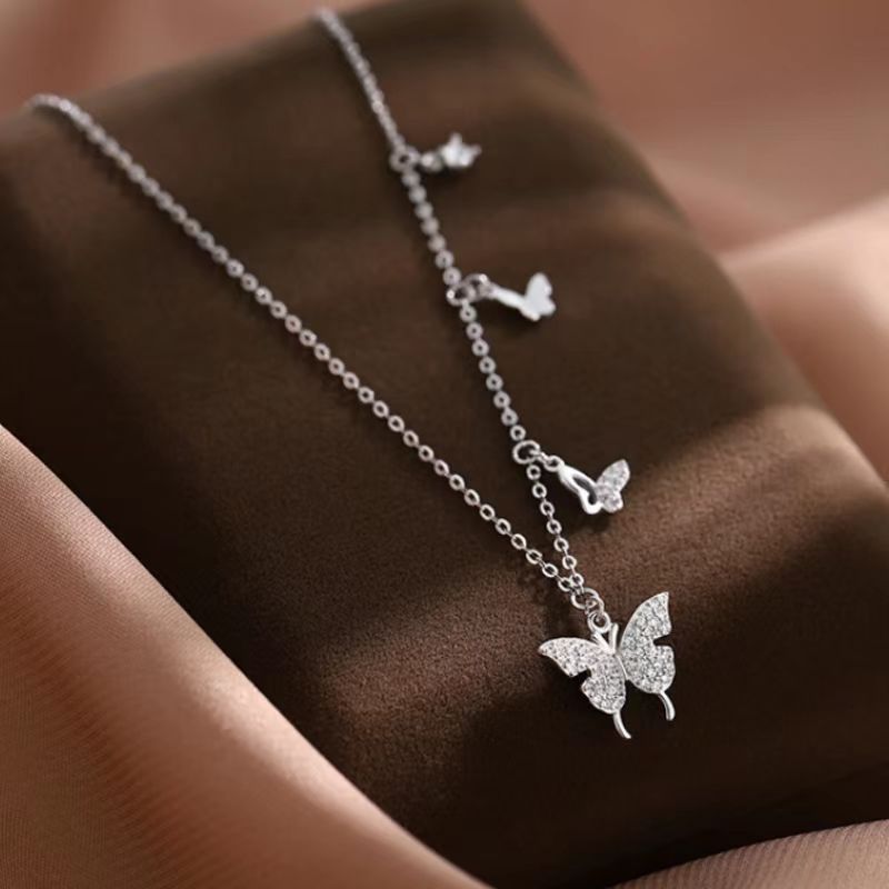Damen Halskette mit filigranem Schmetterlingsdesign und funkelnden Zirkonia Shop Nory