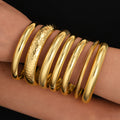 Damen Armreif-Set mit variierenden Oberflächentexturen und glänzenden Akzenten Shop Nory