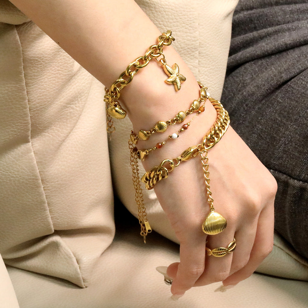 Damen Armschmuck mit Muschel-Design und Zirkonia-Akzenten Shop Nory