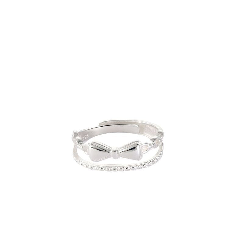 Damen zierlicher Ring mit verspieltem Schleifenmotiv und feinen Zirkonia Akzenten Shop Nory