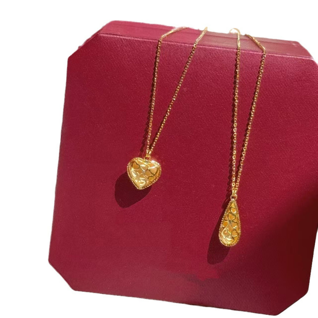 Damen Halskette mit herzförmigem Anhänger aus glänzendem Metall Shop Nory