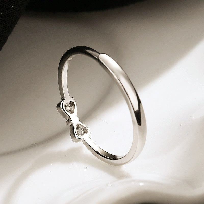 Damen Ring mit zartem Schleifenmotiv und funkelndem Zirkonbesatz Shop Nory