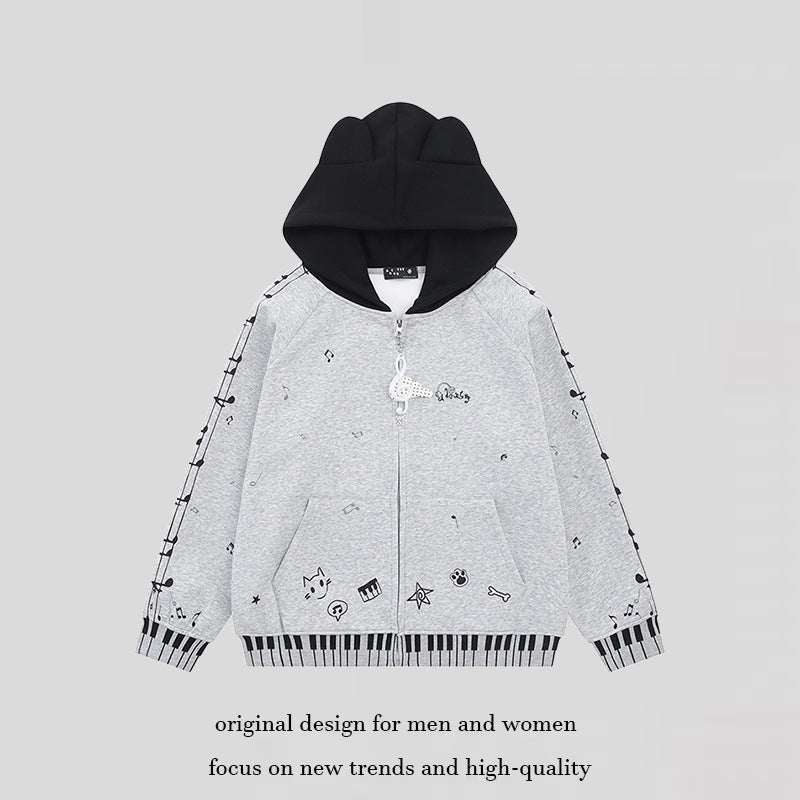 Damen Kapuzensweatjacke mit durchgehendem Reißverschluss, Musikprint, Klaviertasten‑Bündchen und Ohrenkapuze Shop Nory