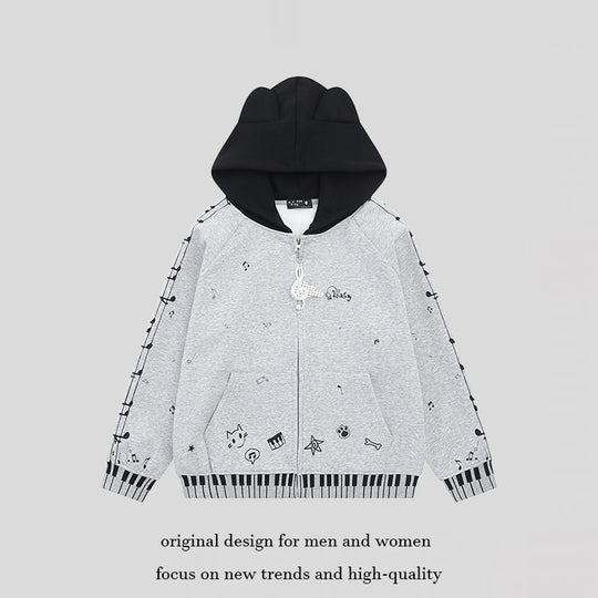 Damen Kapuzensweatjacke mit durchgehendem Reißverschluss, Musikprint, Klaviertasten‑Bündchen und Ohrenkapuze Shop Nory